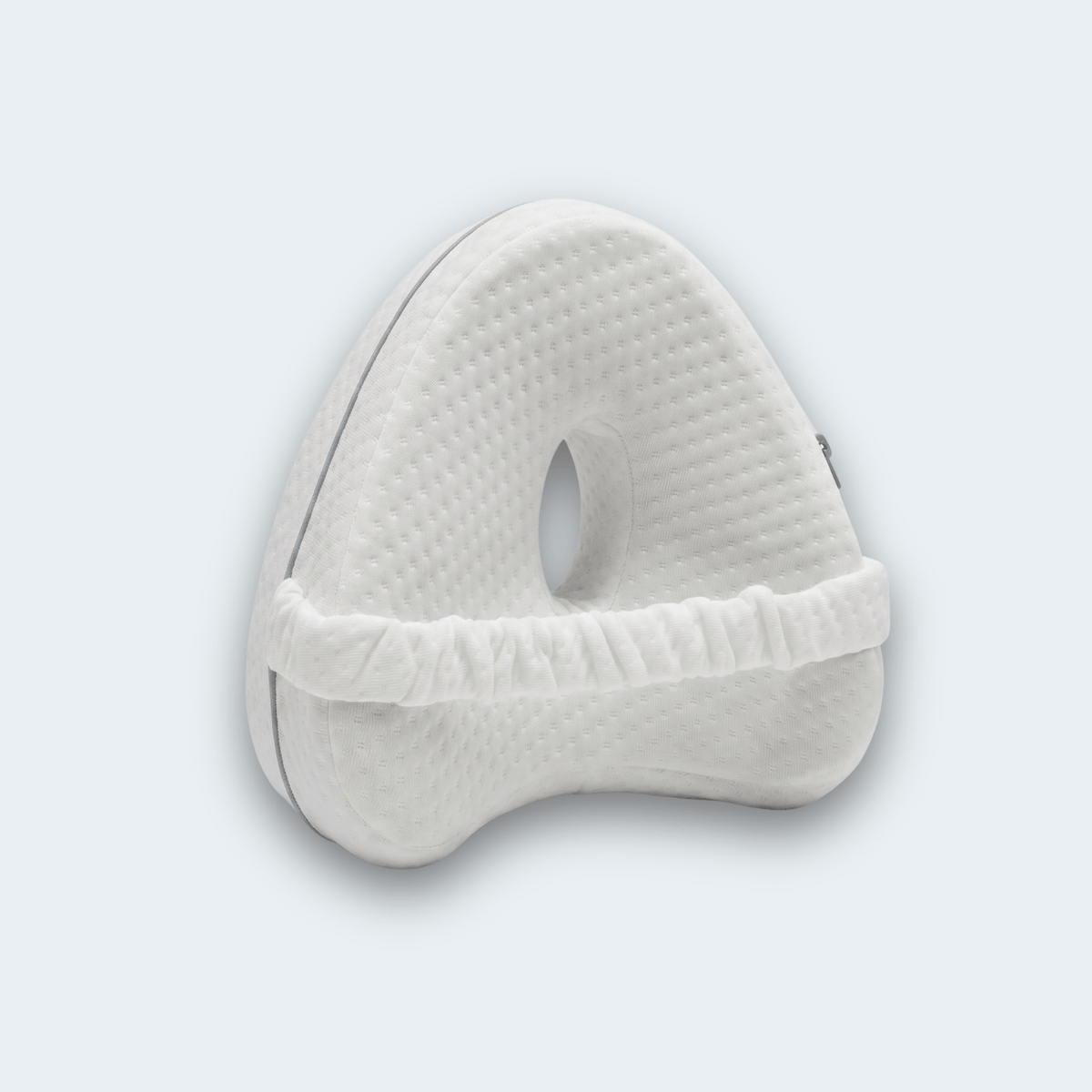 KneeFit knee pillow in white with elastic strap and central cut-out